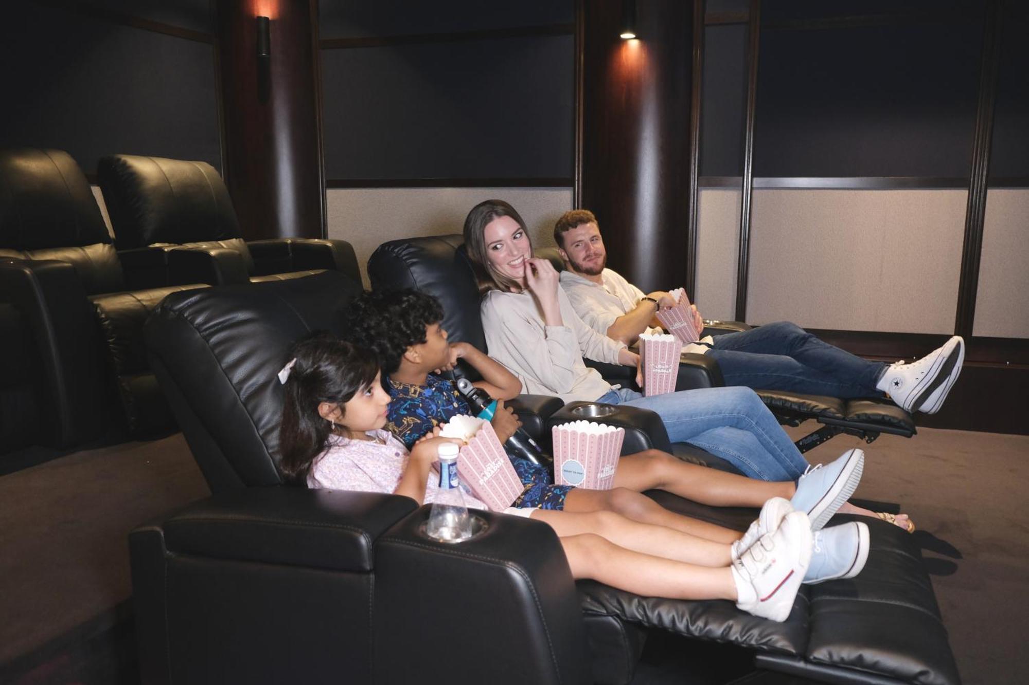 Charthouse Bahrain Hotel Manama Luaran gambar A family watching a movie in a home theater